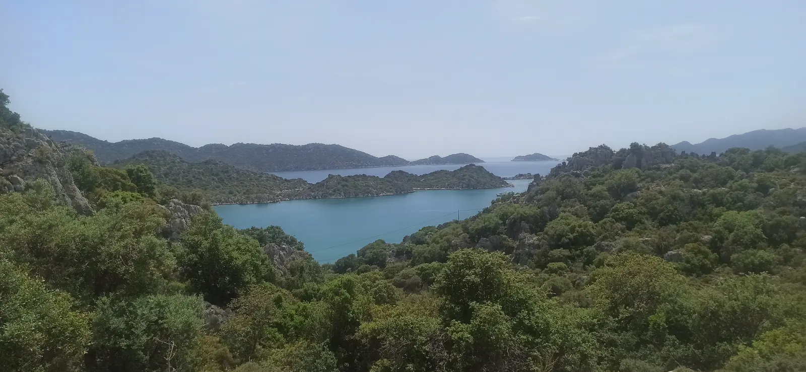 Islands and inlets of the Kekova coast seen over green scrub