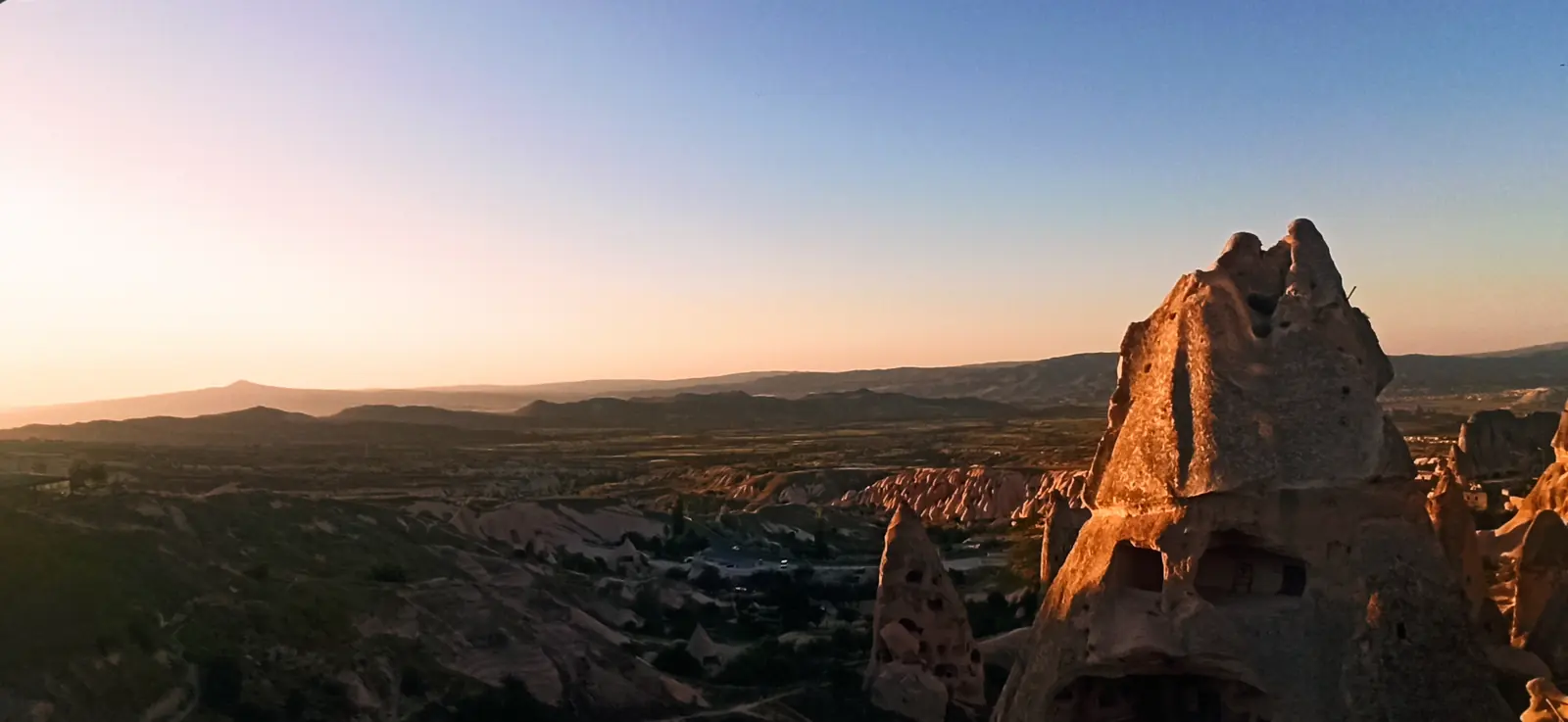 A carved rock pinnacle glowing orange in the last sun